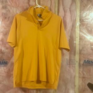 Medium JOS A BANK golf polo shirt. Orange in color